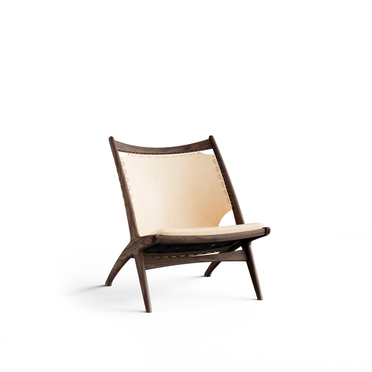 Three-quarter front view of the Eikund Krysset Lounge Chair with a dark brown wood frame, pale tan leather sling back, and matching seat cushion, showing its reclined backrest and crossed side supports.