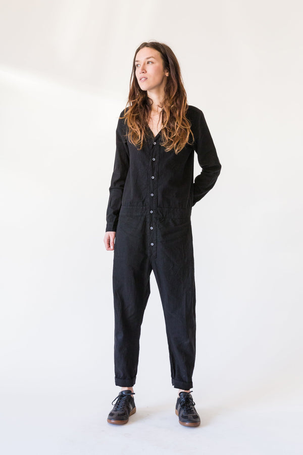 S E E K E R Jumpsuit Long Sleeve in Black – model wearing button-front jumpsuit, full front view, Japandi capsule wardrobe piece
