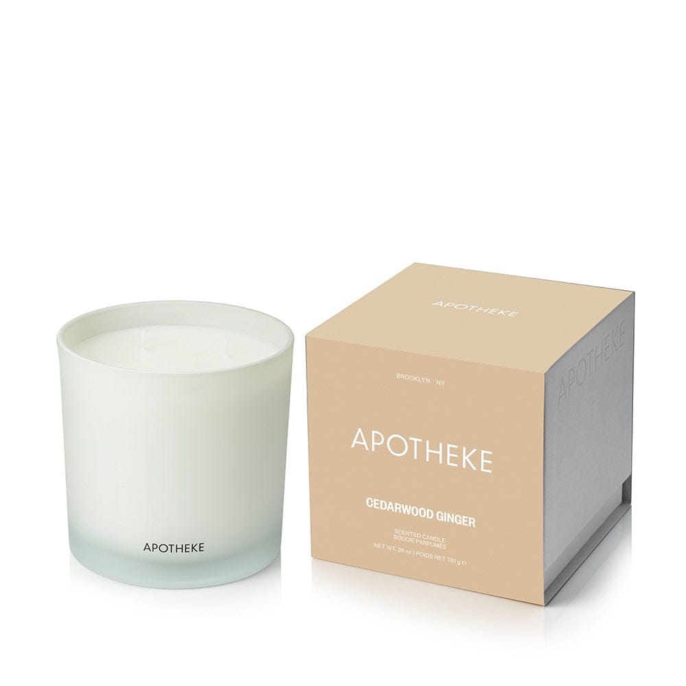 Cedarwood Ginger 3-Wick Candle in white glass vessel beside APOTHEKE packaging box