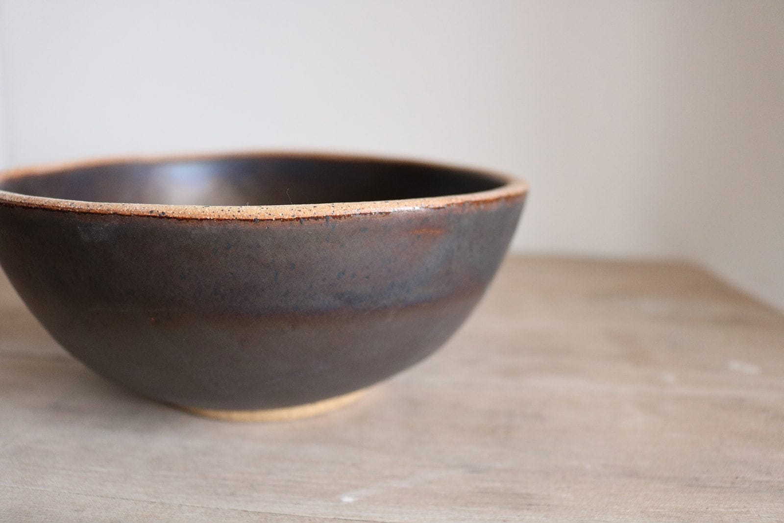 Brown handmade ceramic cereal bowl with warm earth glaze
