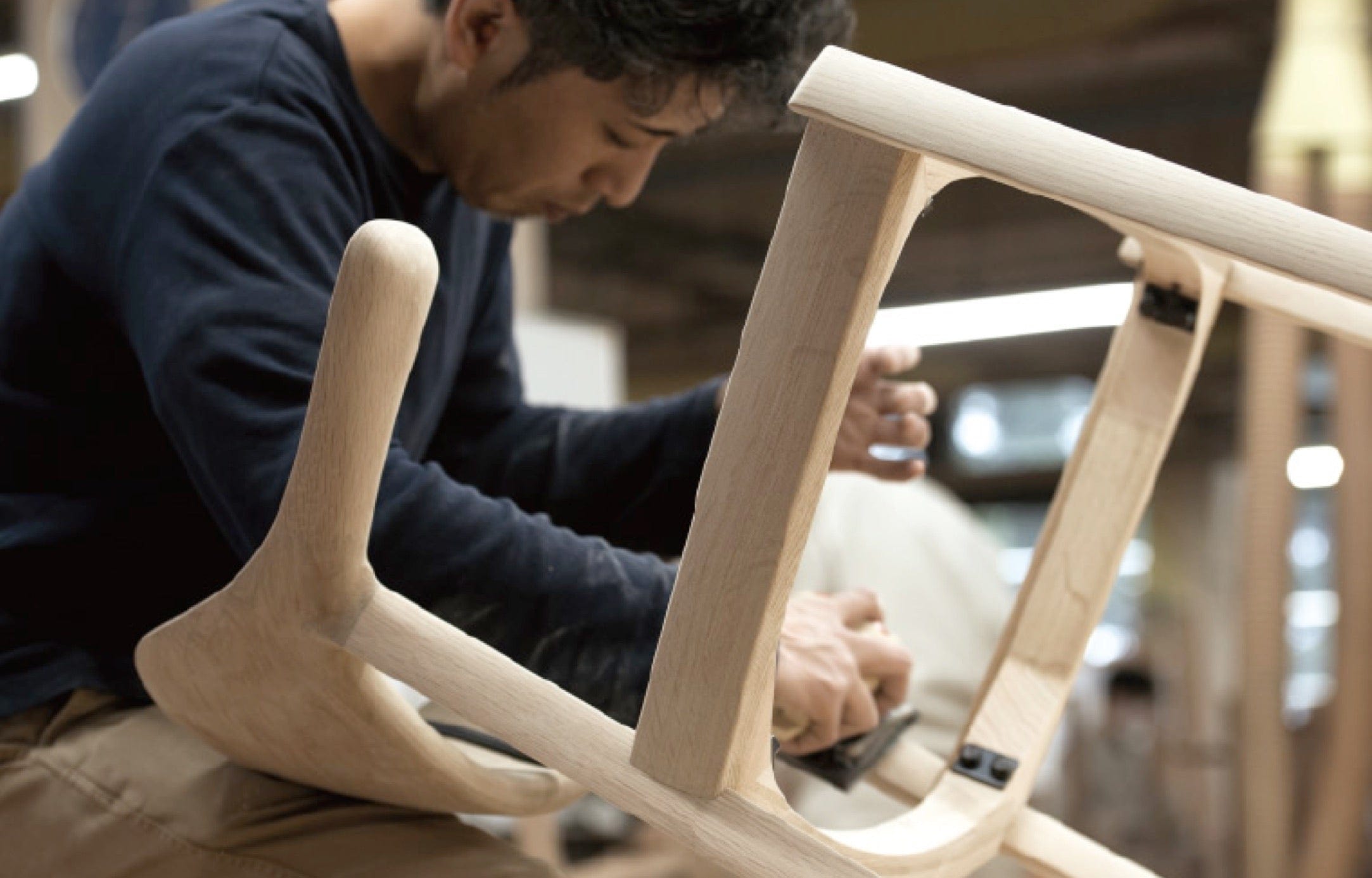 CondeHouse Craftsman working on Chair