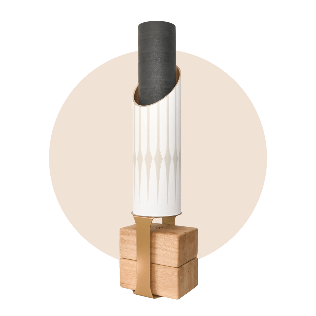 Gather storage tube with a black rolled mat on a pale wood base, framed by a soft beige circle.