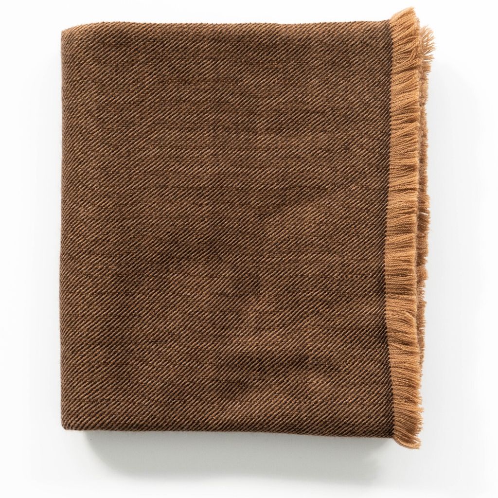 Folded Hay Brown Plush Soft Twill Merino Throw with a short warm-toned fringe against a white background