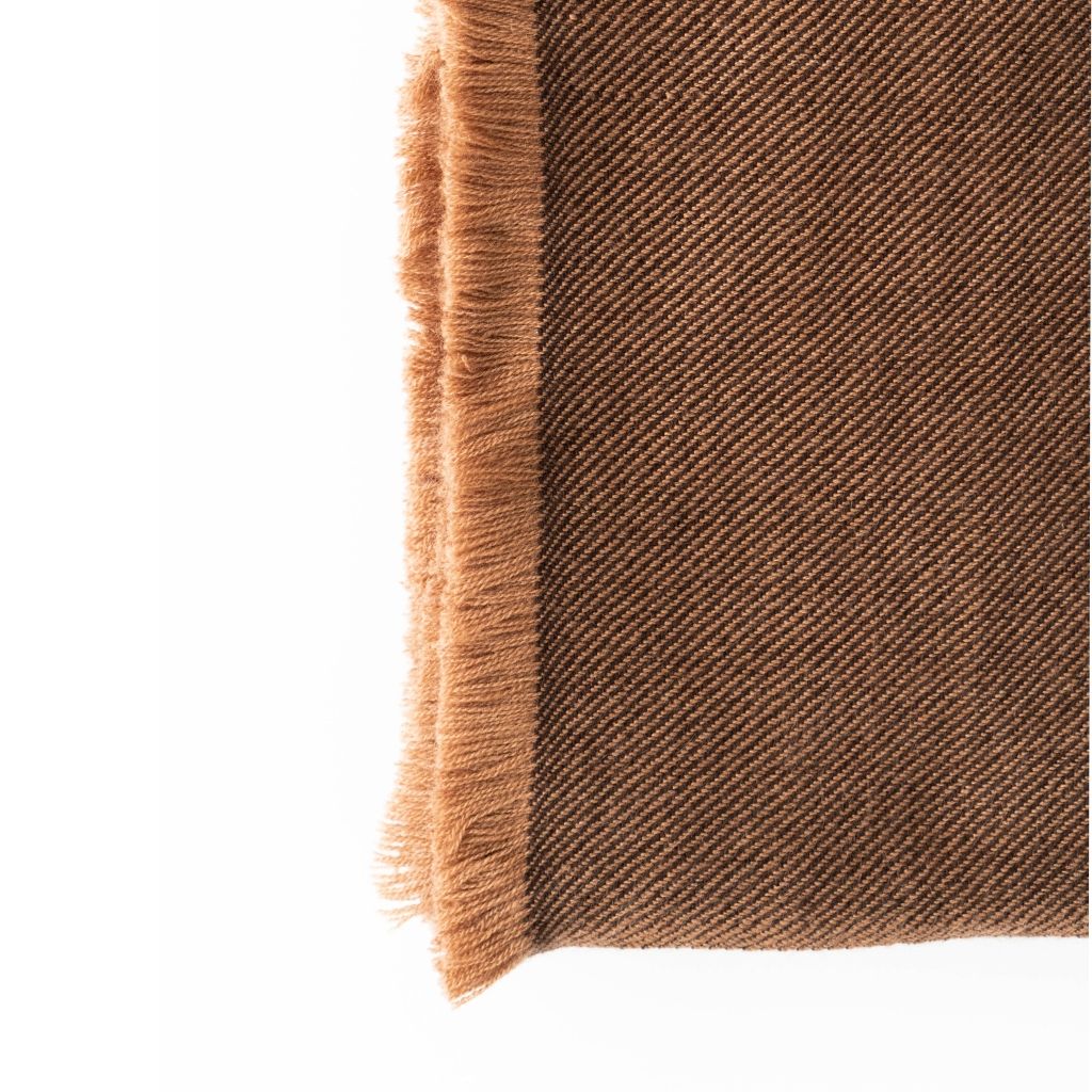 Close-up of the Hay Brown throw’s fine diagonal twill weave and dense golden-brown fringe