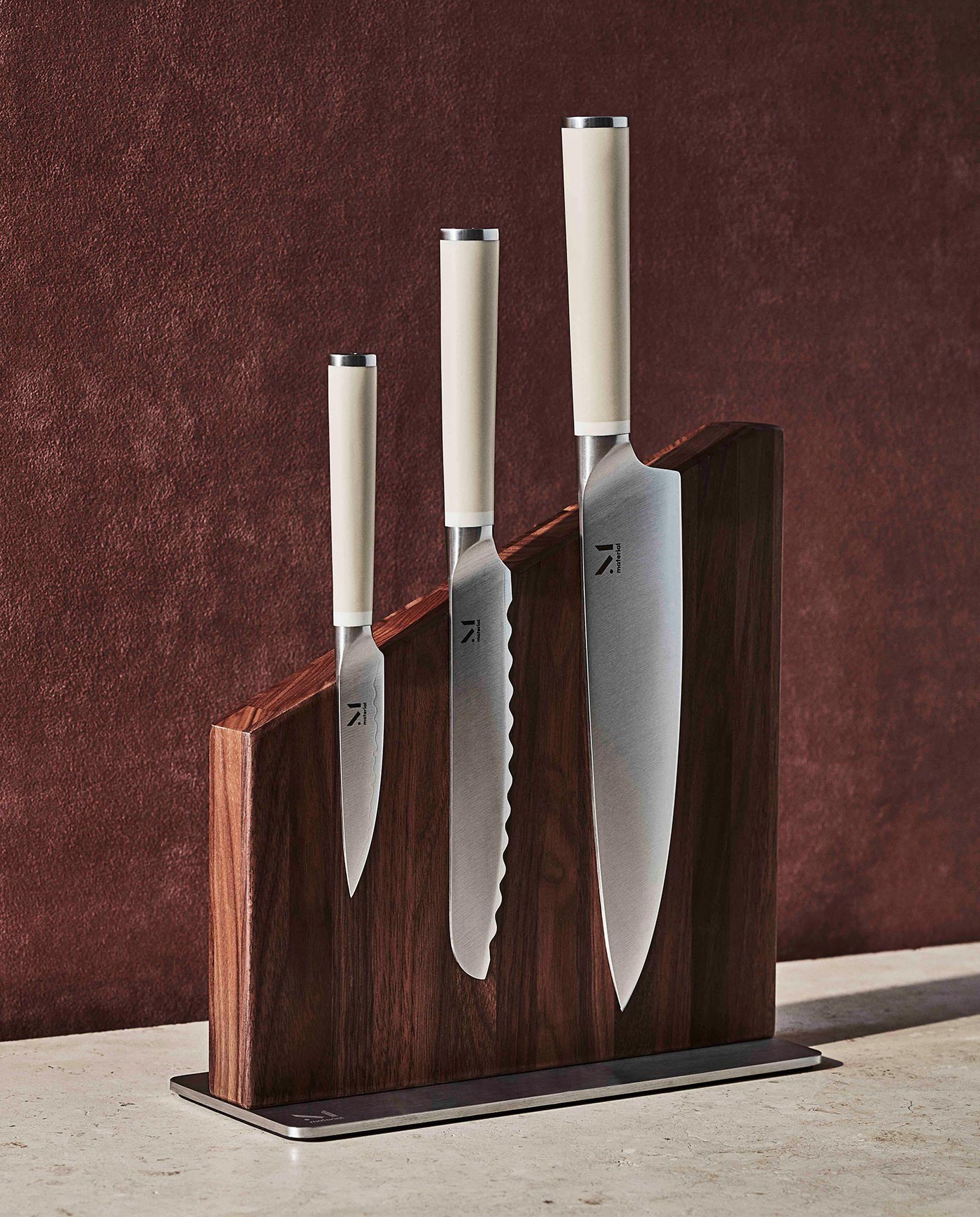 Material chef's knife set displayed in FSC-certified wooden stand