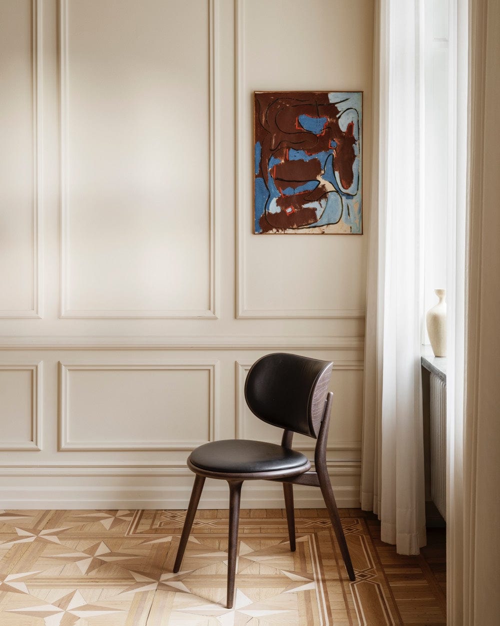 Mater The Dining Chair in black stained beech styled in modern dining space