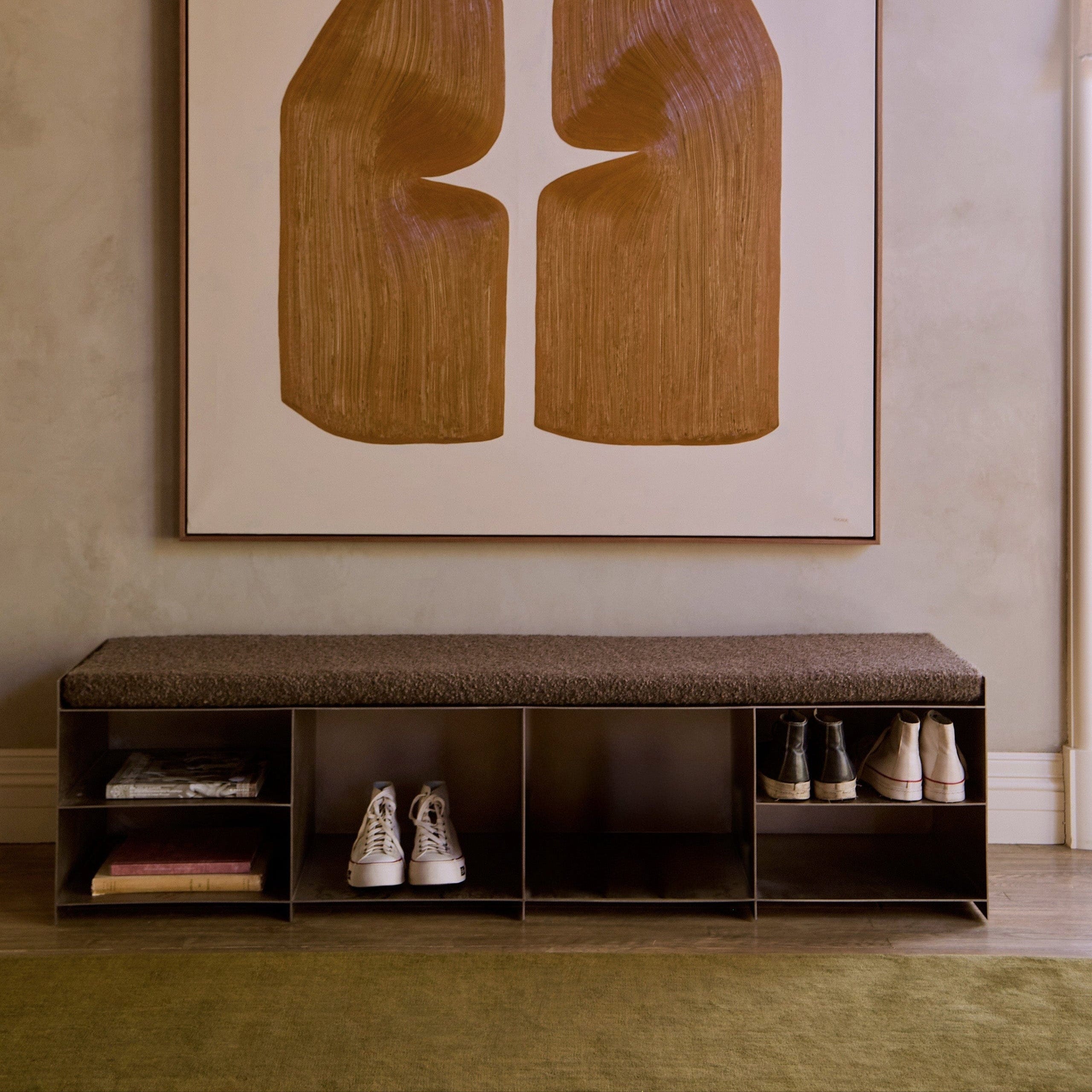 Milan media console styled along wall with shoes and accessories