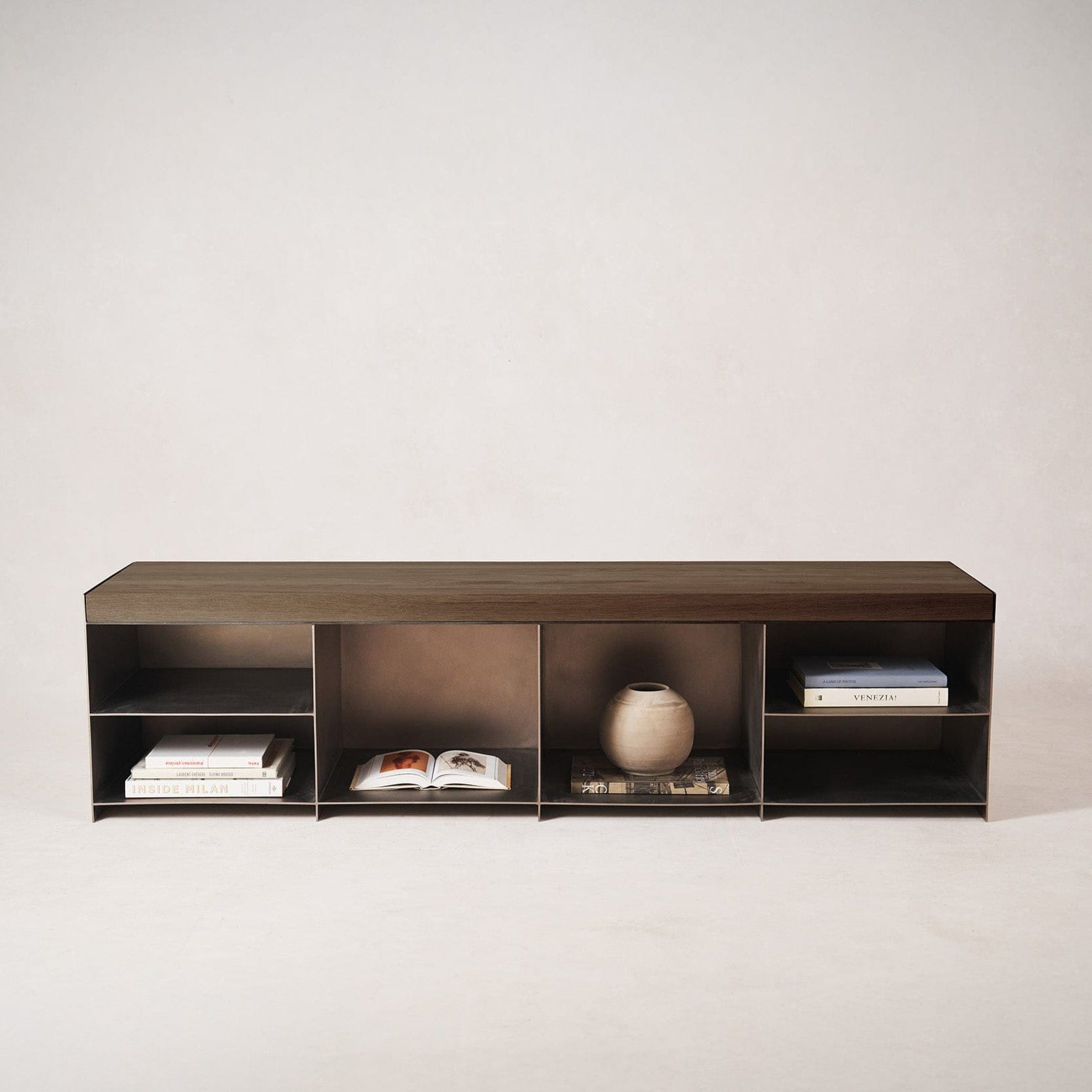 Milan media console styled along wall with shoes and accessories