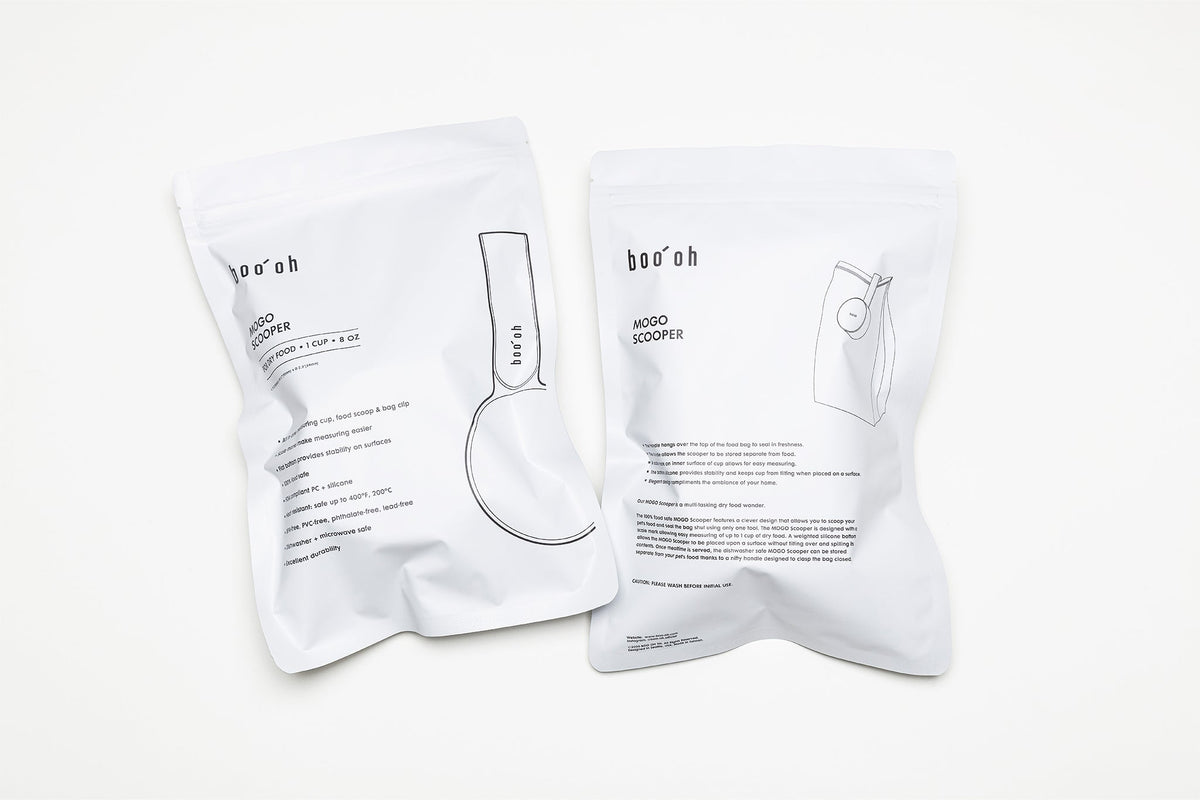 Two white Boo Oh storage pouches printed with product information and simple Mogo Scooper illustrations.