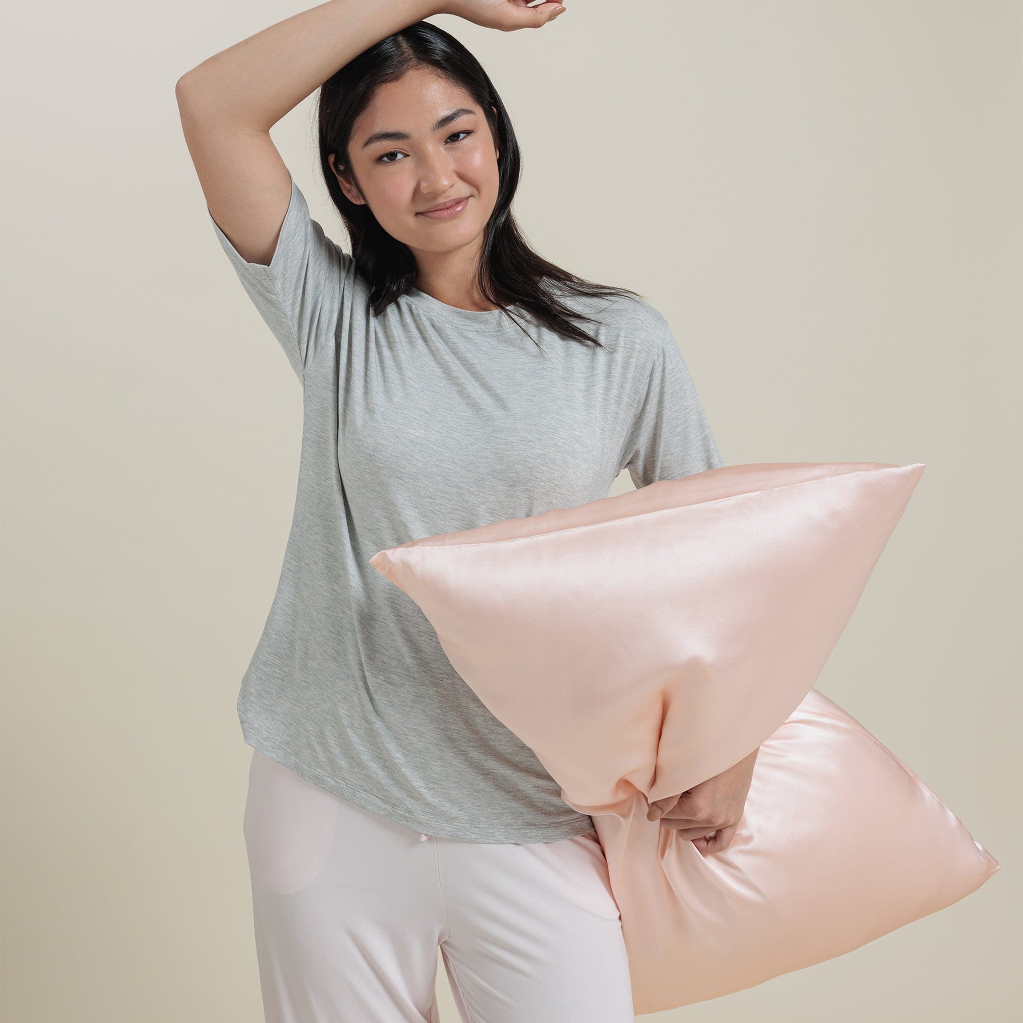 Mulberry Silk Pillowcase in Rosewater in hand