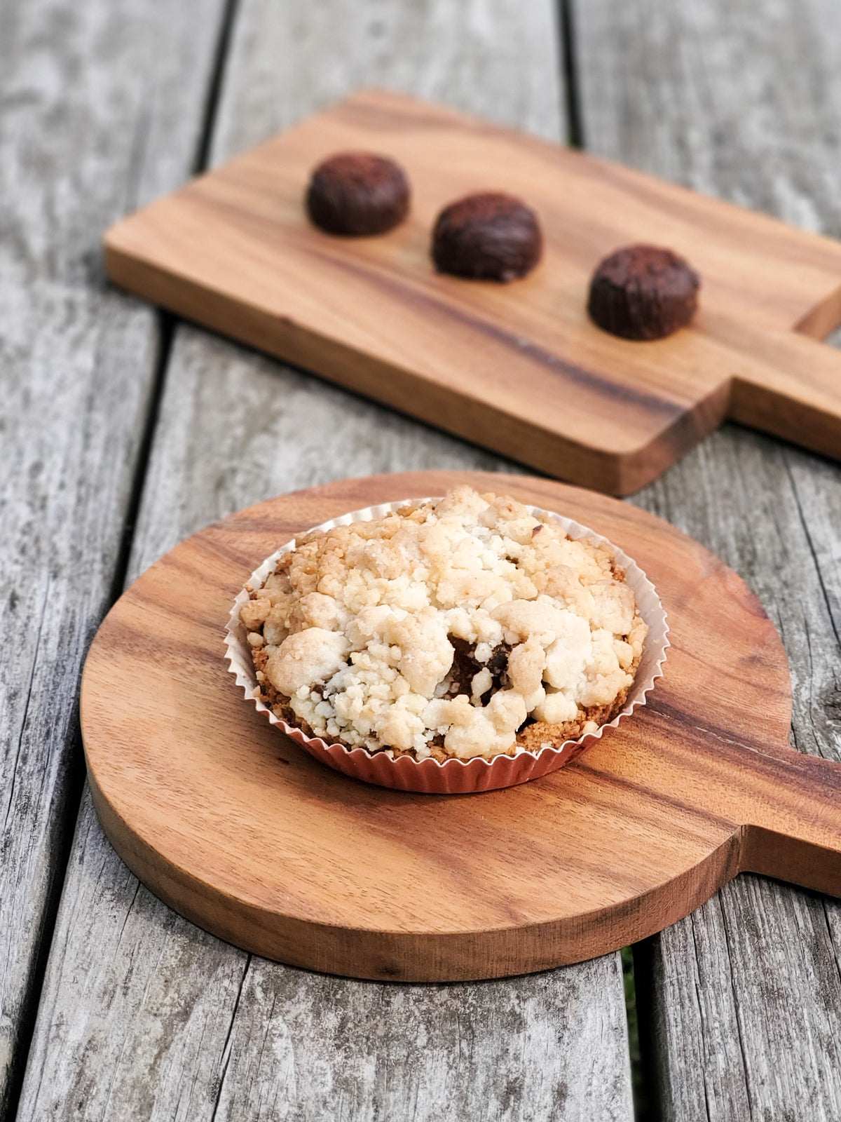 Korissa Wooden Round Serving Board with tart, beside matching square board