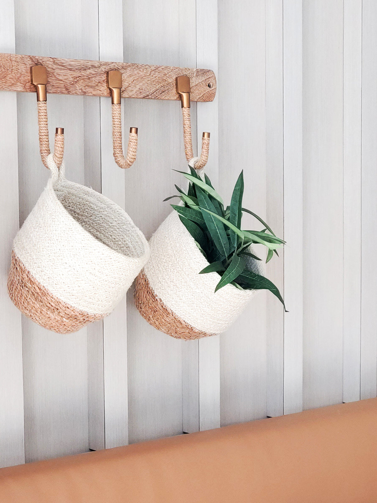 Korissa Amari Loop Bin, set of 2, hanging from wall hooks with plants