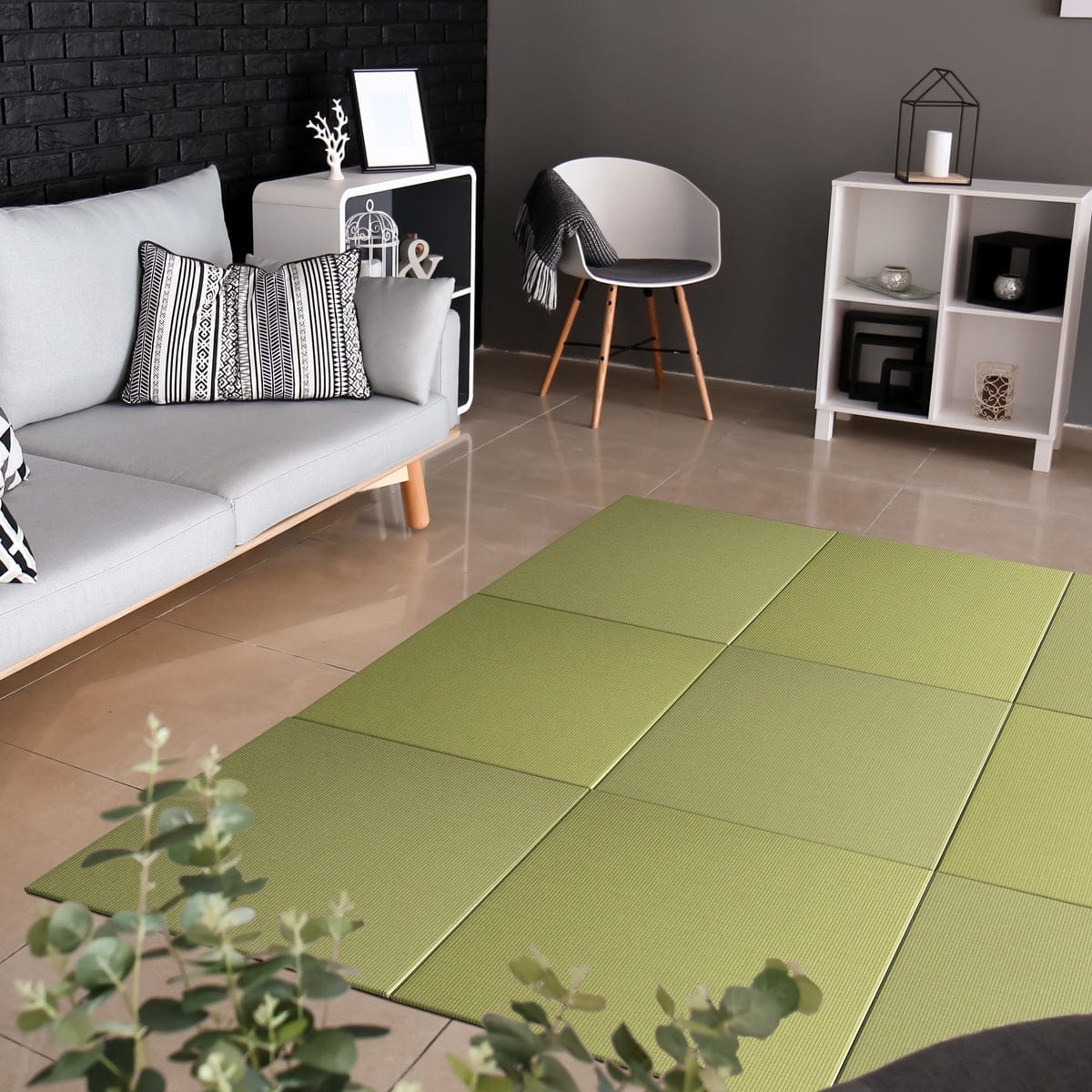 Seiryu SILVER GREEN Japandi Tatami Mat placed on the floor of a modern living room setting, surrounded by a sofa, armchairs, and decorative items.