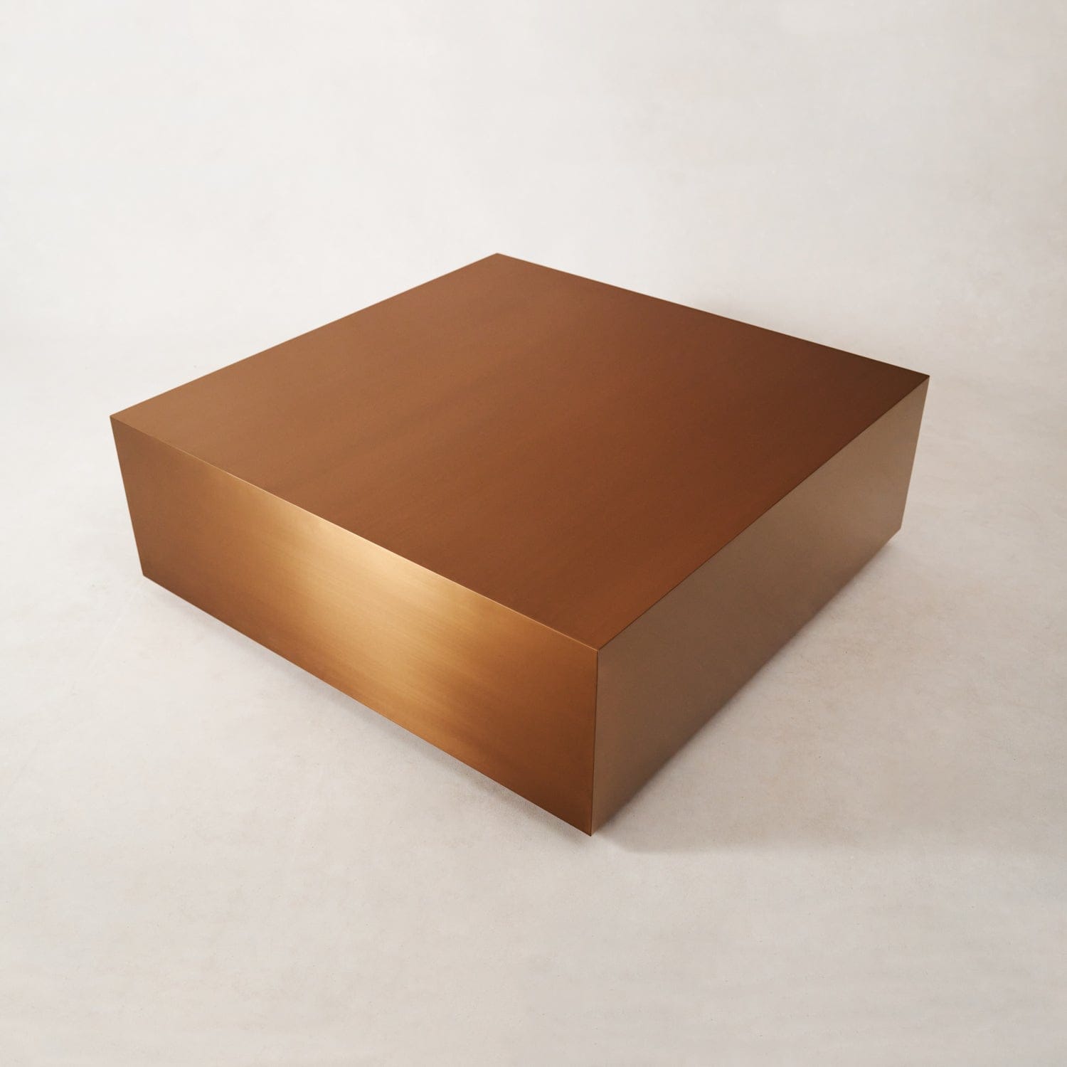 Square copper coffee table with brushed copper finish