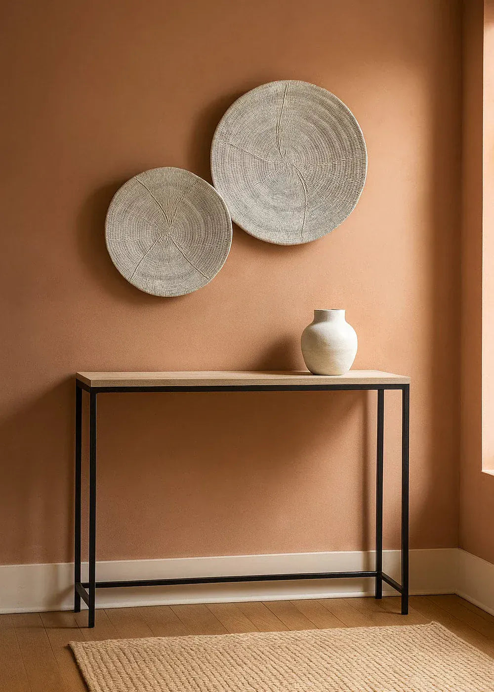 Textural wall accents and baskets in Japandi bedroom