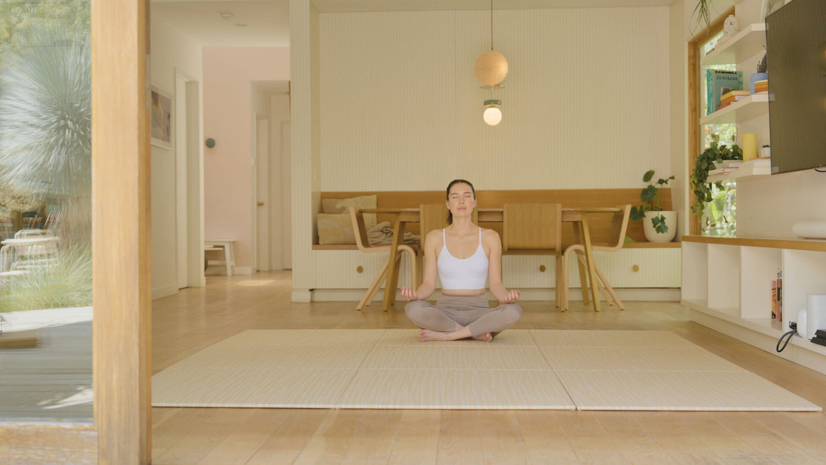 Woman meditating on Japandi Tatami Mats