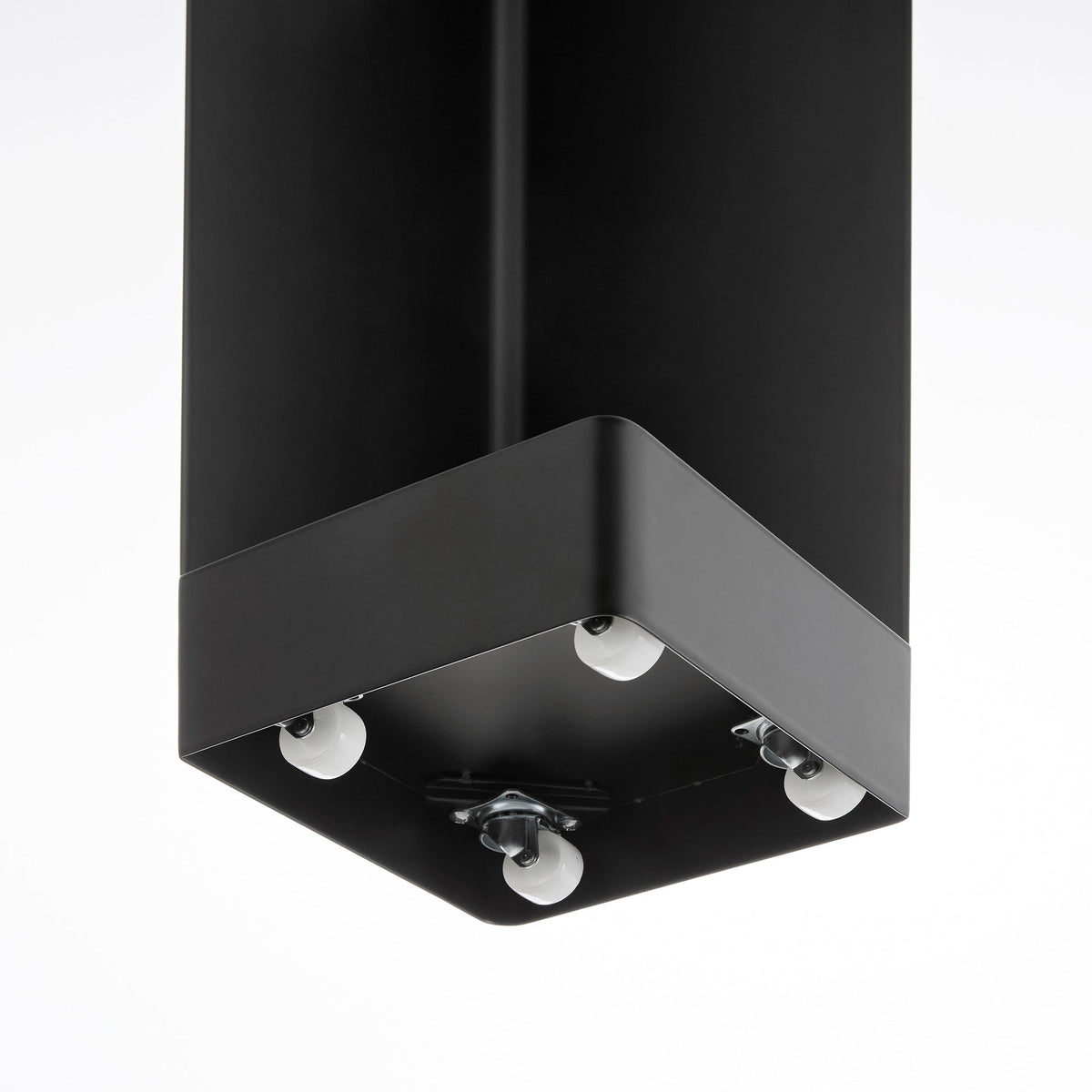 Underside view of the black Yamazaki Home Rolling Bathroom Organizer - Steel, revealing small white caster wheels beneath the square black base.