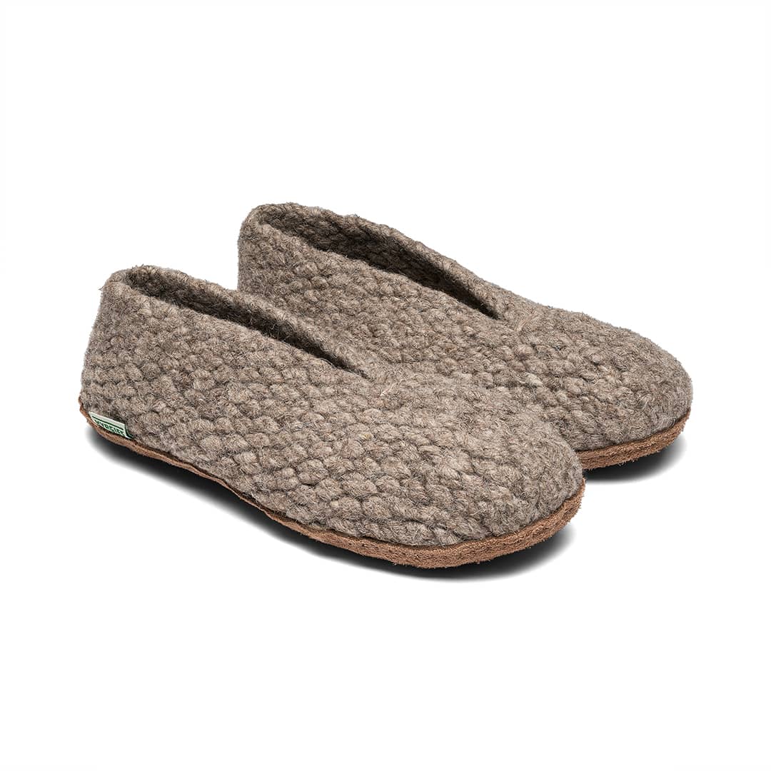 Kyrgies Woven Pair of brown slippers on a white background