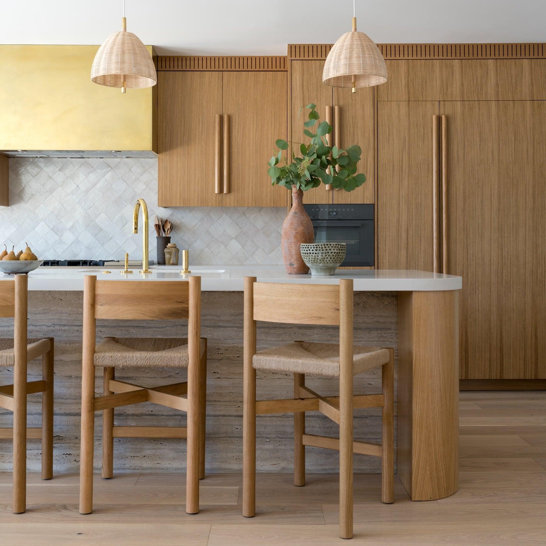 White oak Nonna counter stools around dining counter
