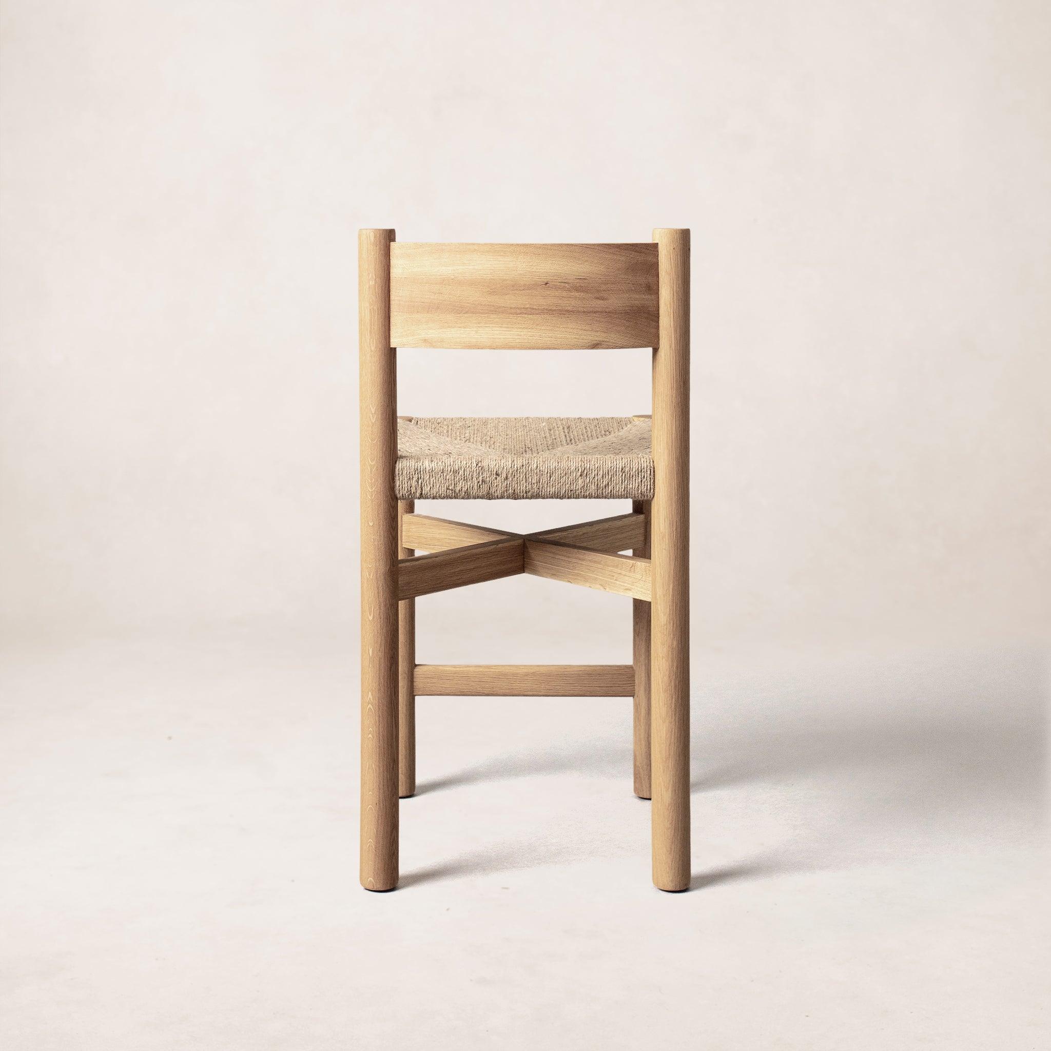 Nonna counter stool side profile showing curved backrest
