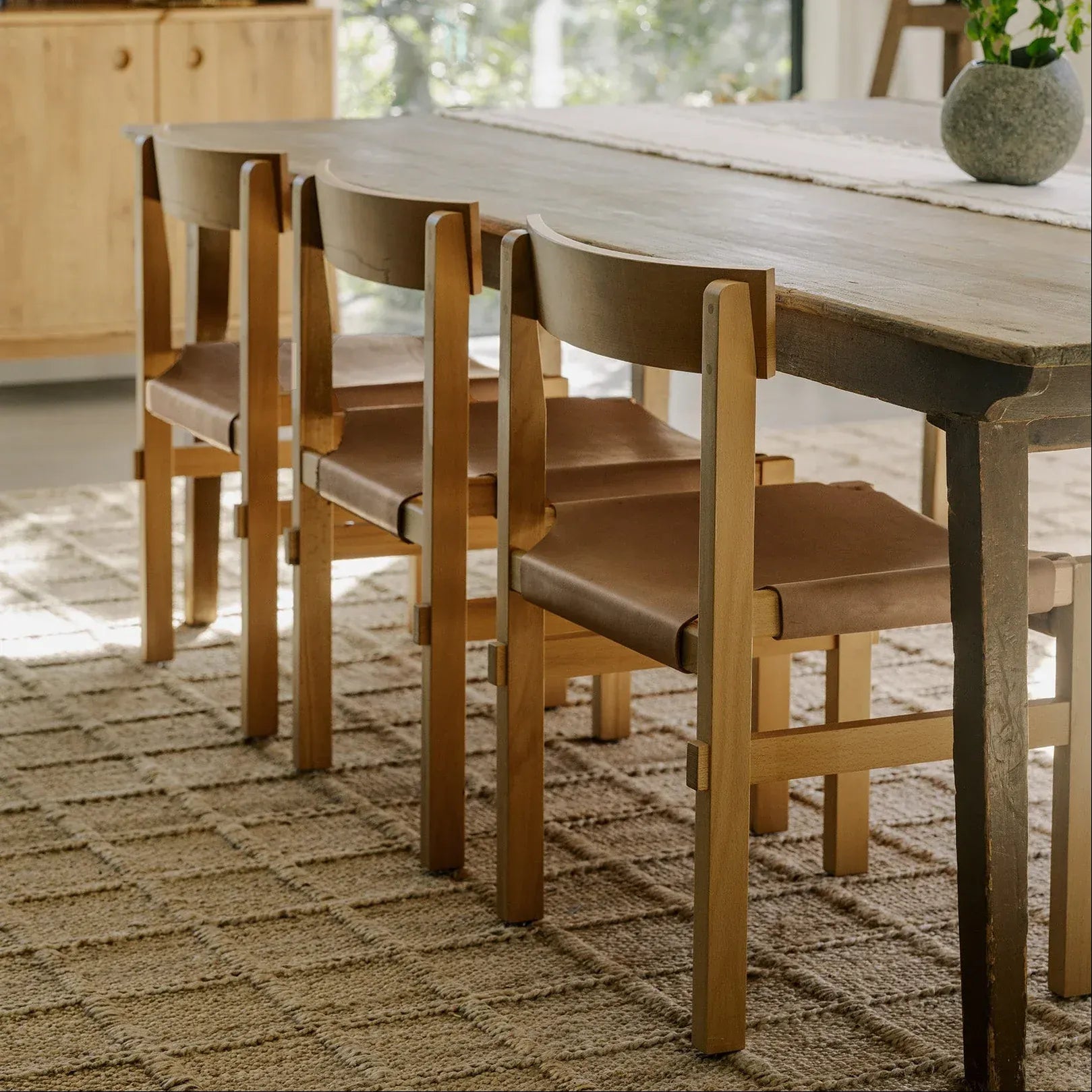 Dining table styled with Shinto dining chairs and neutral tones