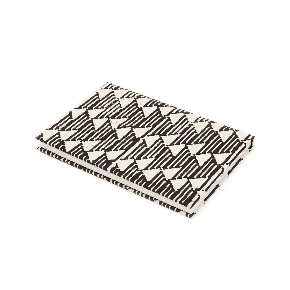 Variously Tria handmade journal with a black-and-white geometric triangle-patterned cover and visible handcrafted binding against a white background