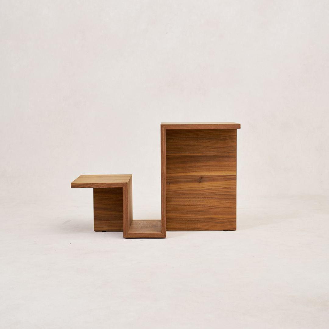 Modern sculptural side table made from solid walnut