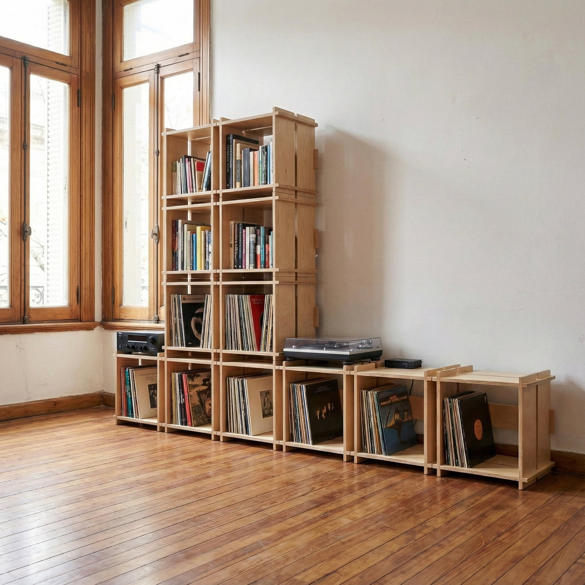Multiple Williamsburg Cubical units stacked into a tall modular bookcase and arranged as low storage for books, records and audio equipment
