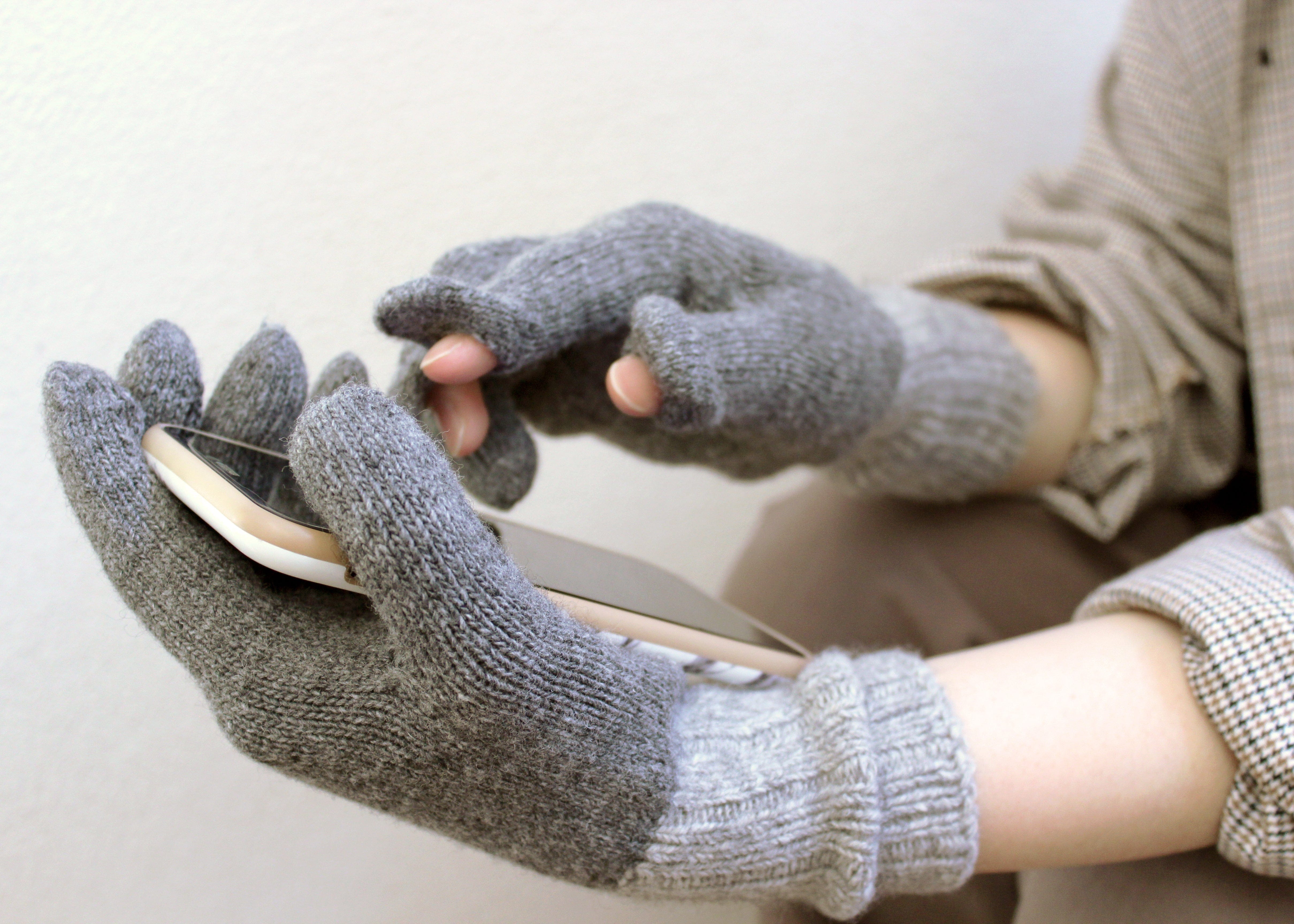 Recycled Wool Blend Japanese Winter Gloves using a phone