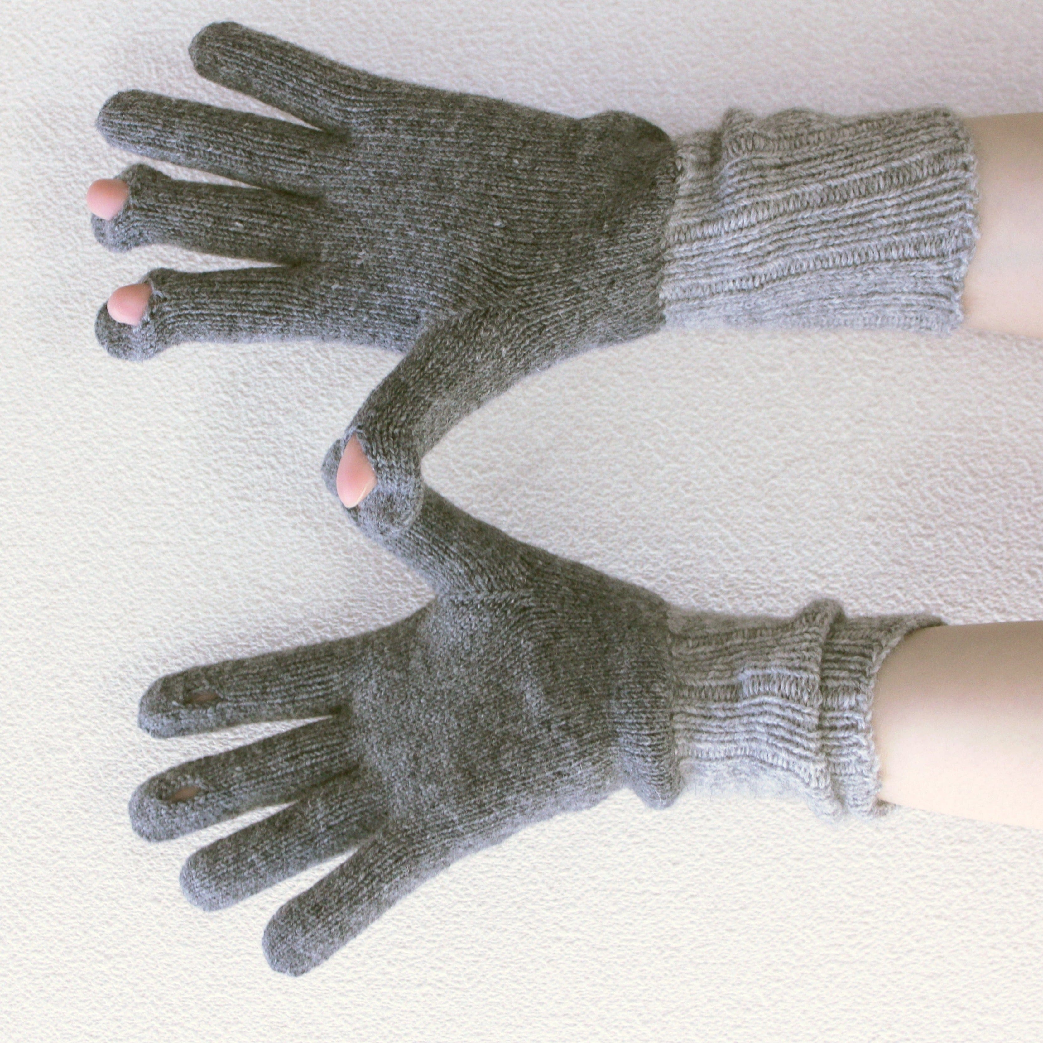 Pair of gray gloves on a white background