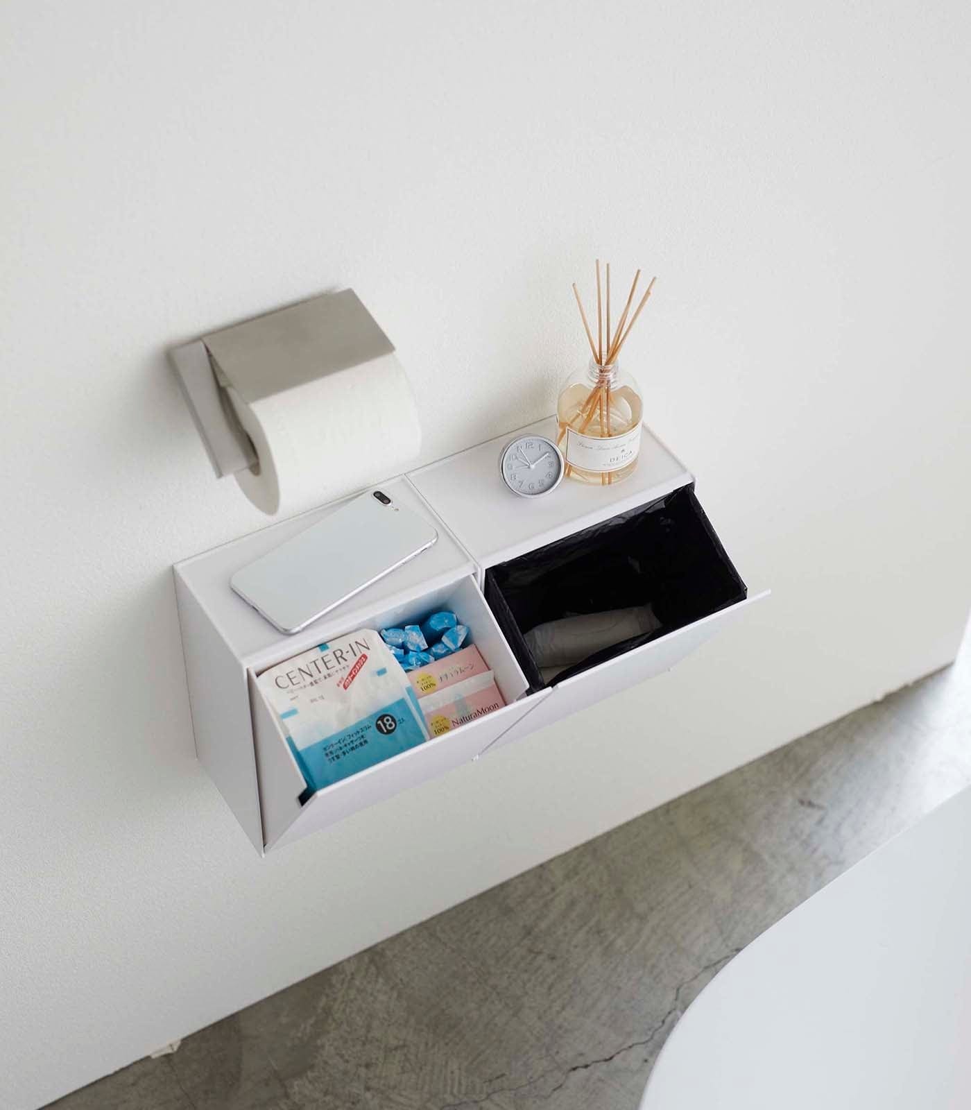 Wall-Mounted Storage or Trash Bin Side by Side in Bathroom, shown two