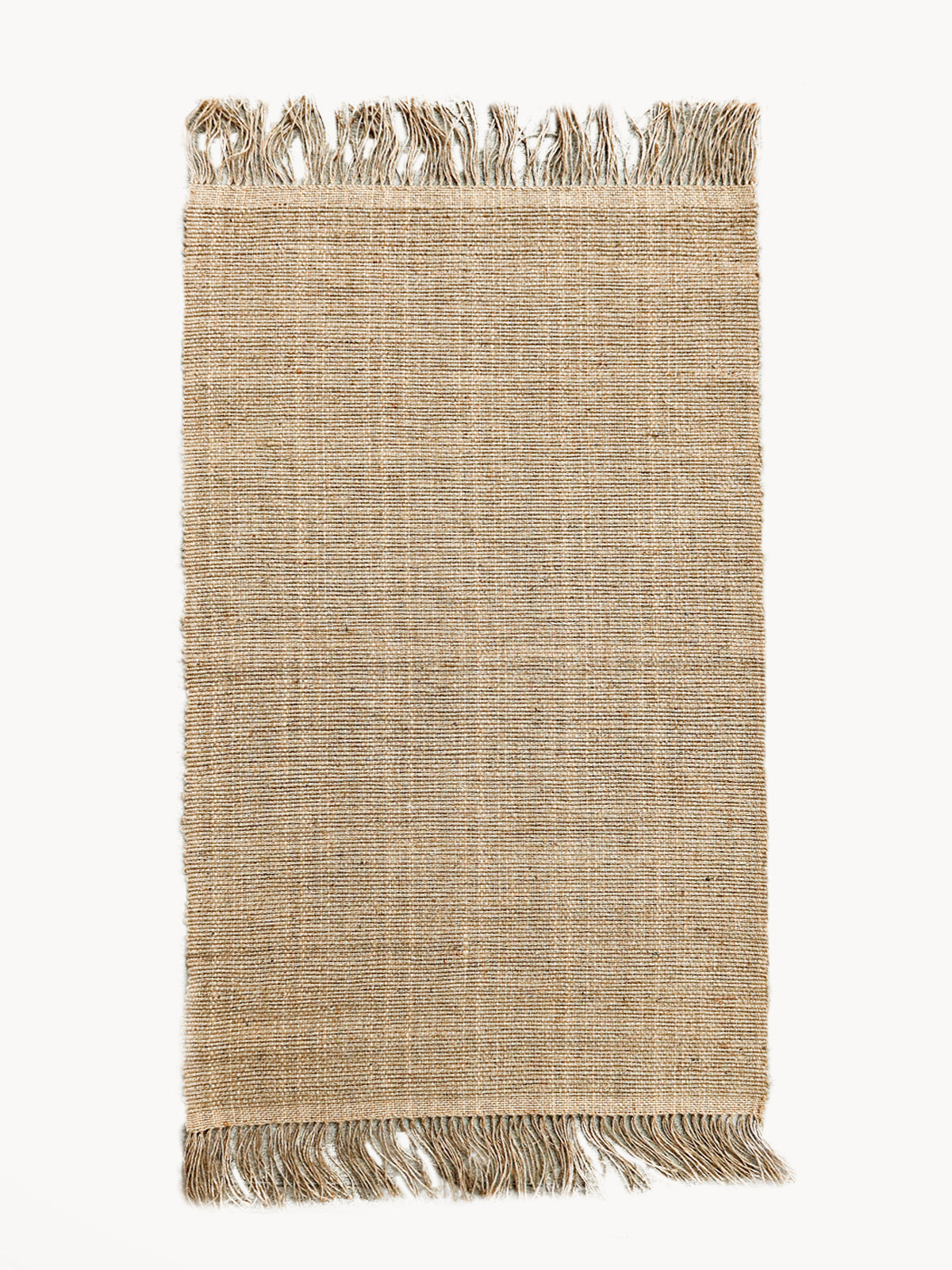 Korissa Goldilocks Rug, natural braided jute, fringe edges, white background
