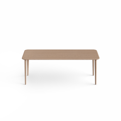 Elevated front view of the light wood Eikund Evja Rectangle Coffee Table, showing a rectangular grain-patterned top with rounded corners, a gently beveled edge, and four slender tapered legs against white.