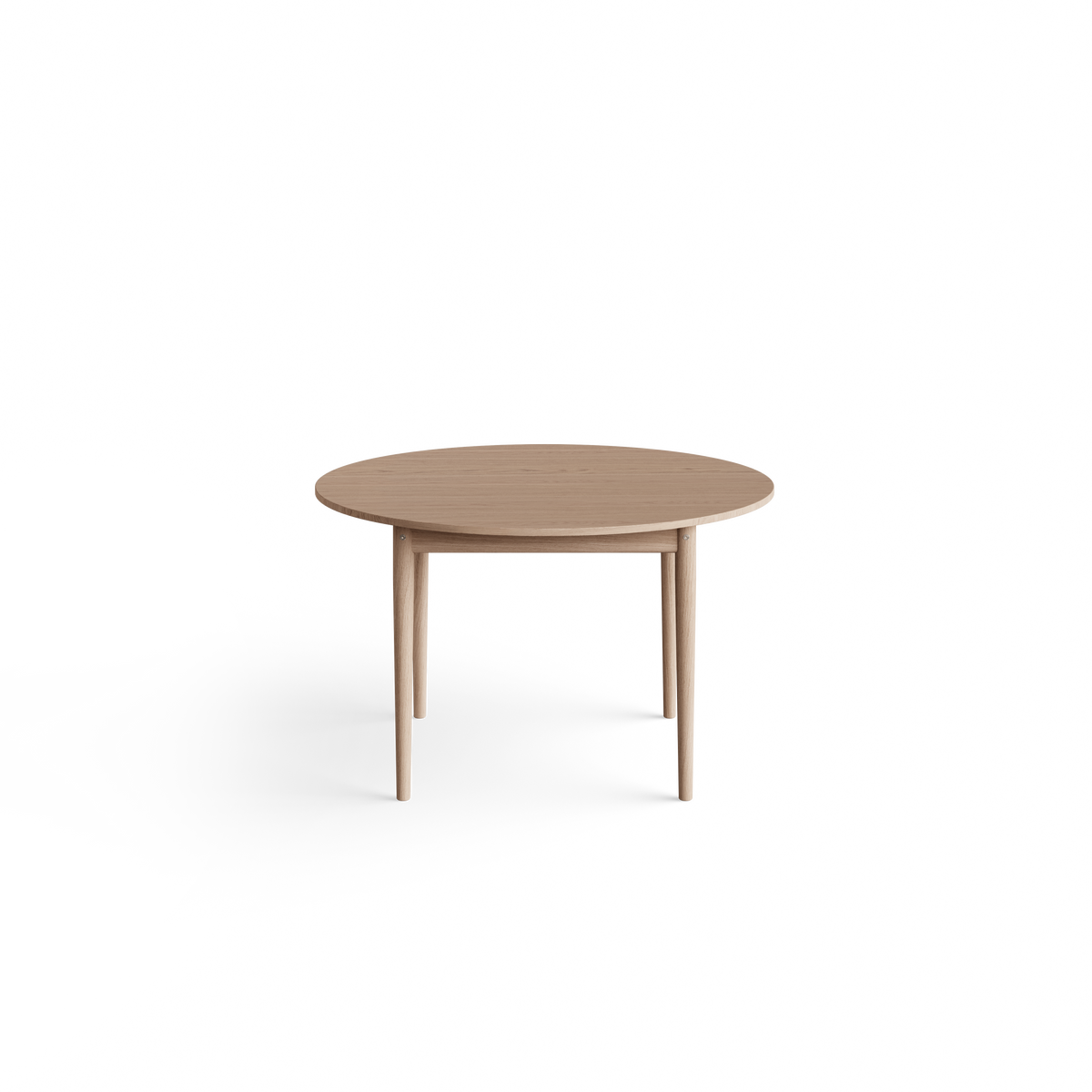 Eikund Oma Static Dining Table against a white background, showing a round light wood tabletop with visible grain, a thin rounded edge, recessed wood apron, and slender tapered legs.