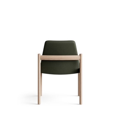 Rear view of the Eikund Ry Dining Chair, showing a smooth olive-green upholstered back crossed by a horizontal light wood rail, with slim wood uprights extending into the rear legs.