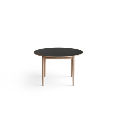 Eikund Oma Static Dining Table with a dark charcoal round top, contrasting light wood edge, and tapered wood legs, viewed against a white background.