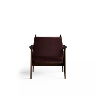Rear view of the reddish-brown Eikund Broadway Lounge Chair, showing the broad leather back panel between dark wood uprights, curved armrest ends, and exposed lower frame.