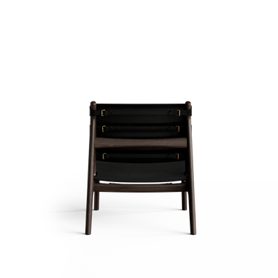 Rear view of the black Eikund Hunter Lounge Chair, showing horizontal leather tension straps with buckles across the back and the exposed dark wood frame.