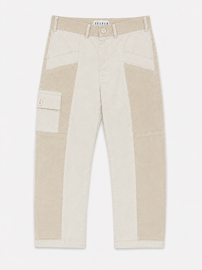 Front product view of cream Trek pants with contrasting tonal panels and a buttoned cargo pocket.