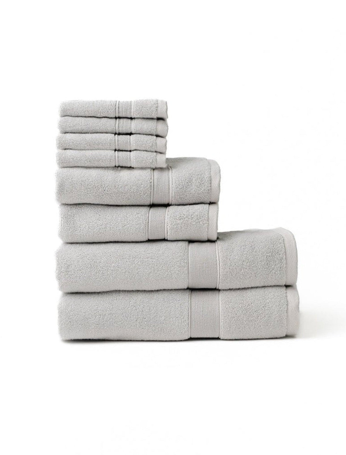 Light gray towel set stacked in a stepped arrangement on a white background, with washcloths above hand towels and larger bath towels.