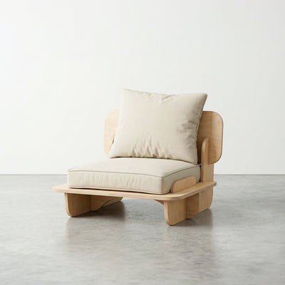Front angled studio view of the Franklin single low seater with white cushions, curved arm panels and a low natural wood base