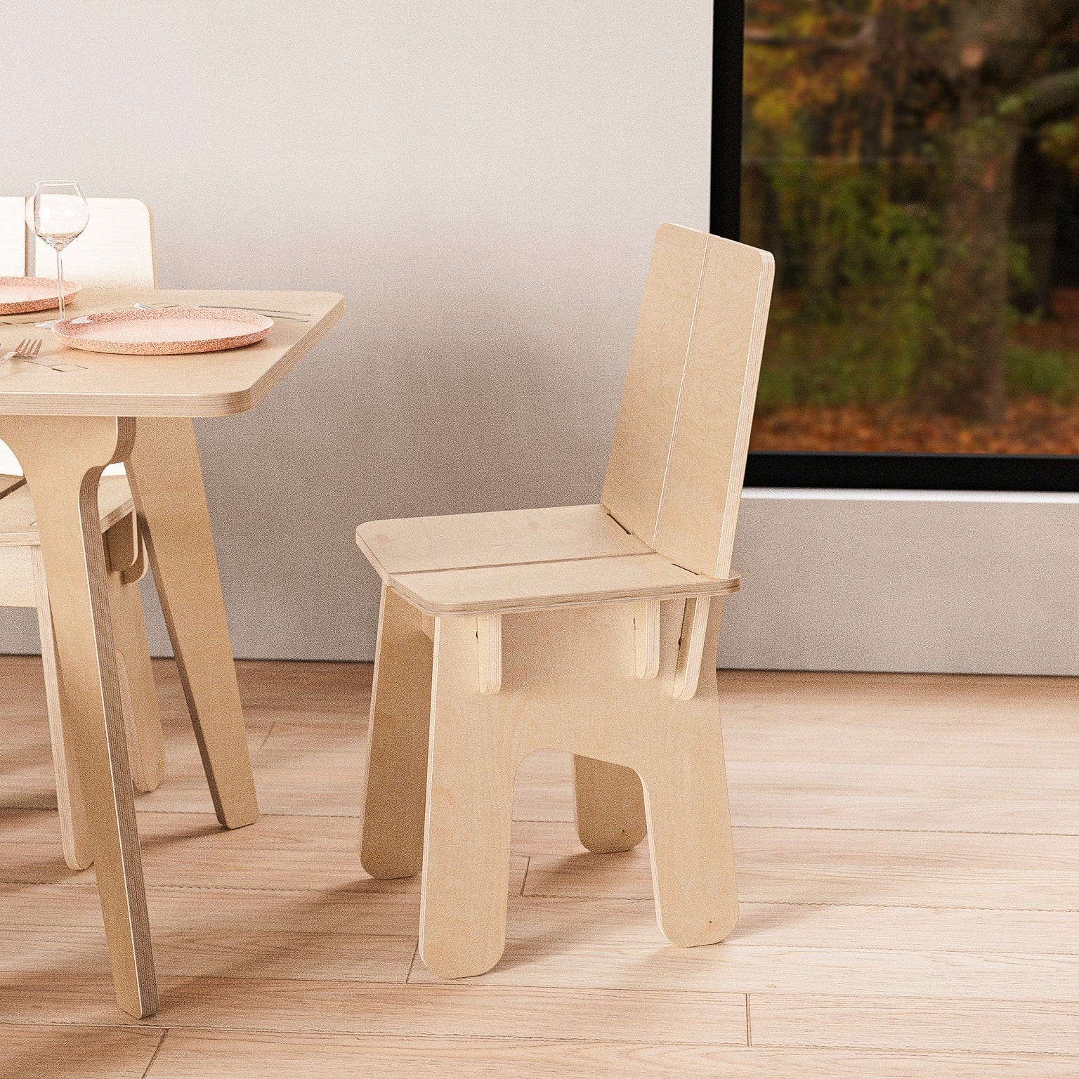 Side view of the BURIJ natural wood chair beside a table, showing its tall backrest, sculpted seat supports and rounded legs