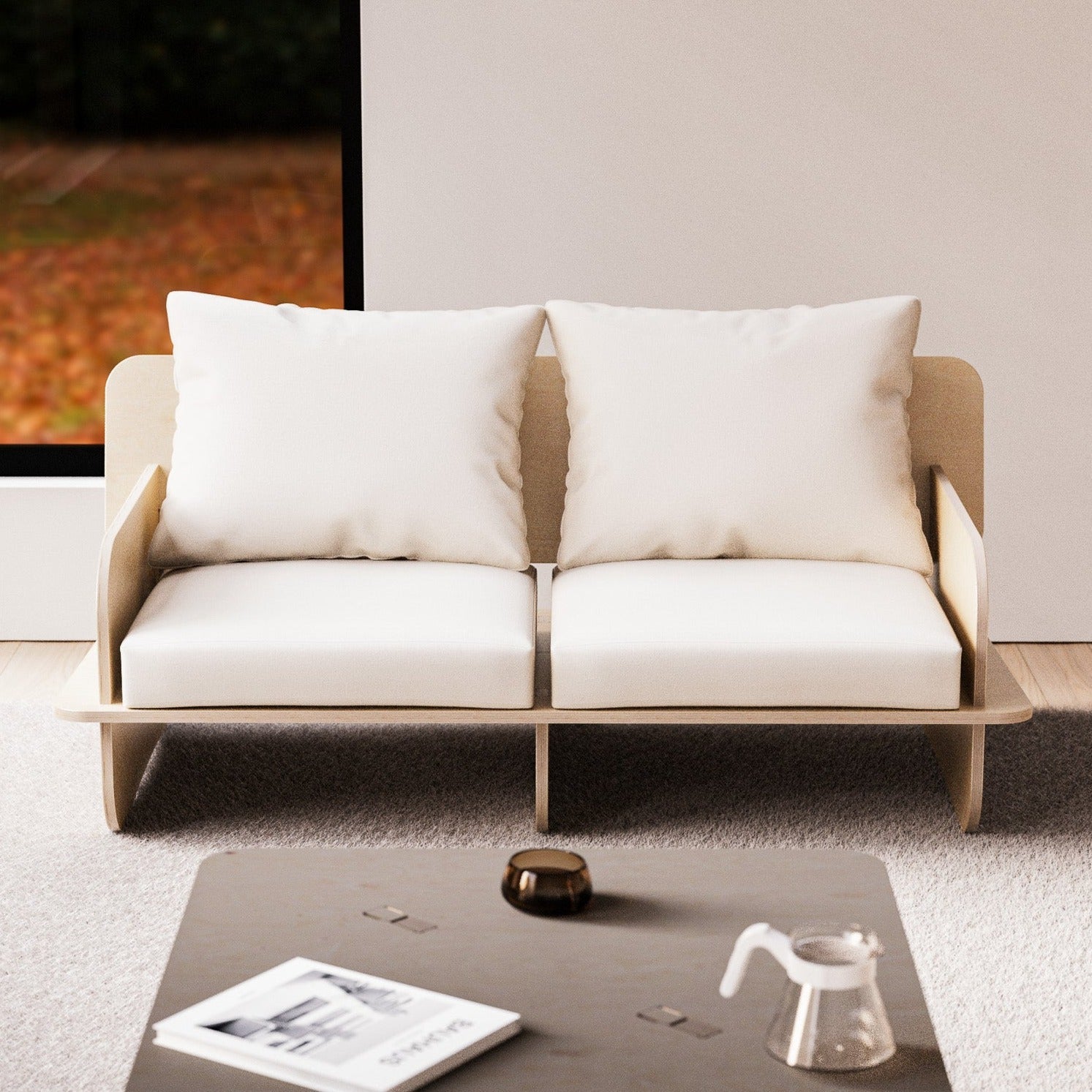 Franklin two-seat low seater with a pale natural wood platform frame, curved side panels and thick white seat and back cushions in a bright living room
