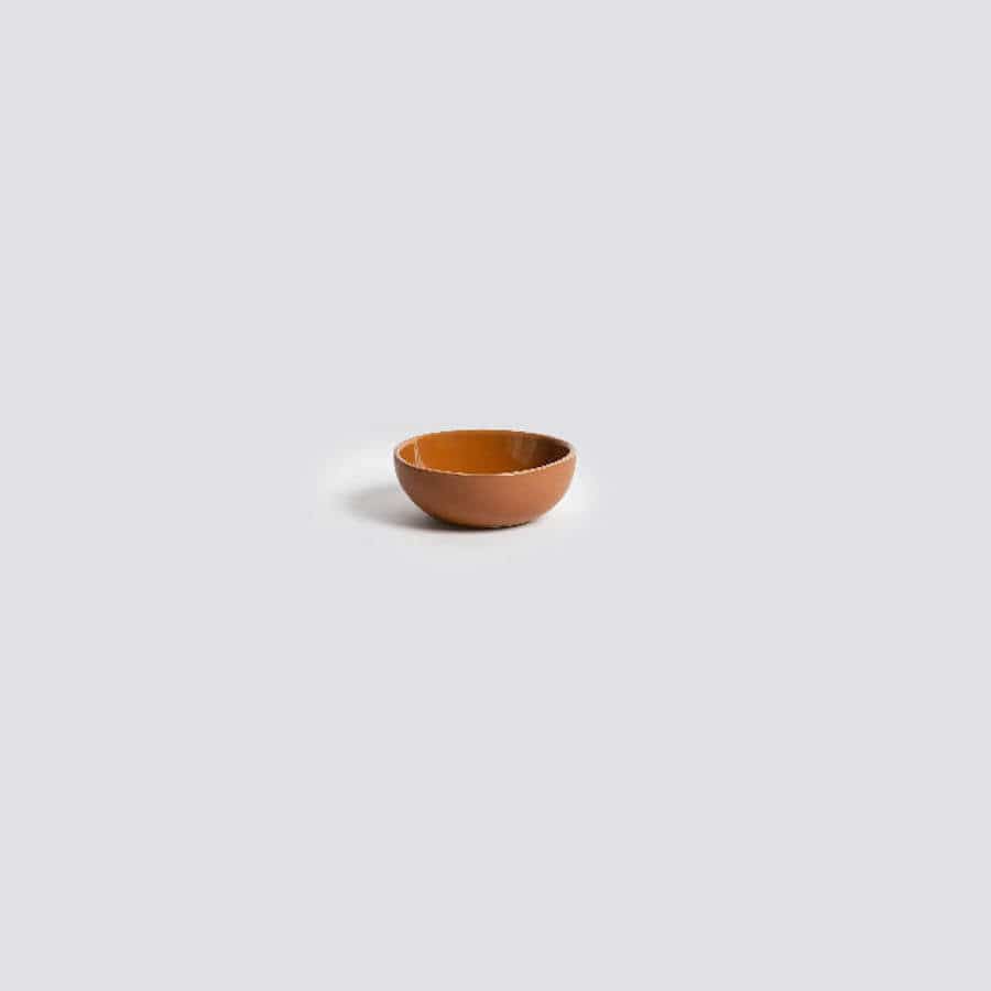 Gharyan Stoneware Japandi Tableware Condiment Bowl, terracotta, against speckled background
