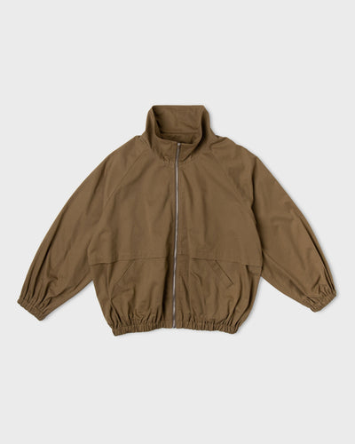 Khaki-brown Paulette Lee Bomber Jacket displayed against a light background, with a stand collar, silver-colored front zipper, loose sleeves, gathered cuffs and hem, and a horizontal panel above the lower pockets.