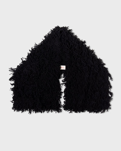 Black Paulette Saint-Jean-de-Luz Oversize Scarf arranged against a light background, showing two broad ends, a central opening, and a thick shaggy texture.