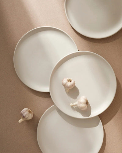 Gharyan Stoneware Japandi Tableware Dinner Plate, Matte White, styled with garlic