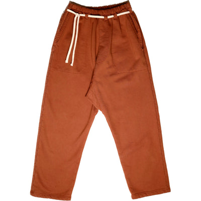 Front product view of rust-orange Picasso pants with a relaxed drop-crotch fit and white drawstring.