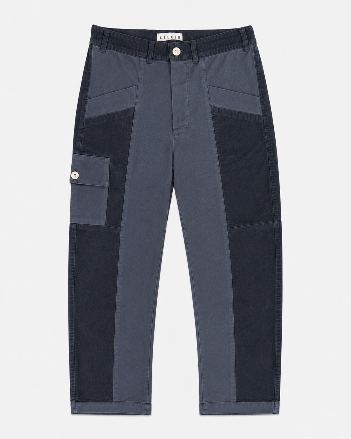 Front product view of slate-blue Trek pants with contrasting tonal panels and a buttoned cargo pocket.