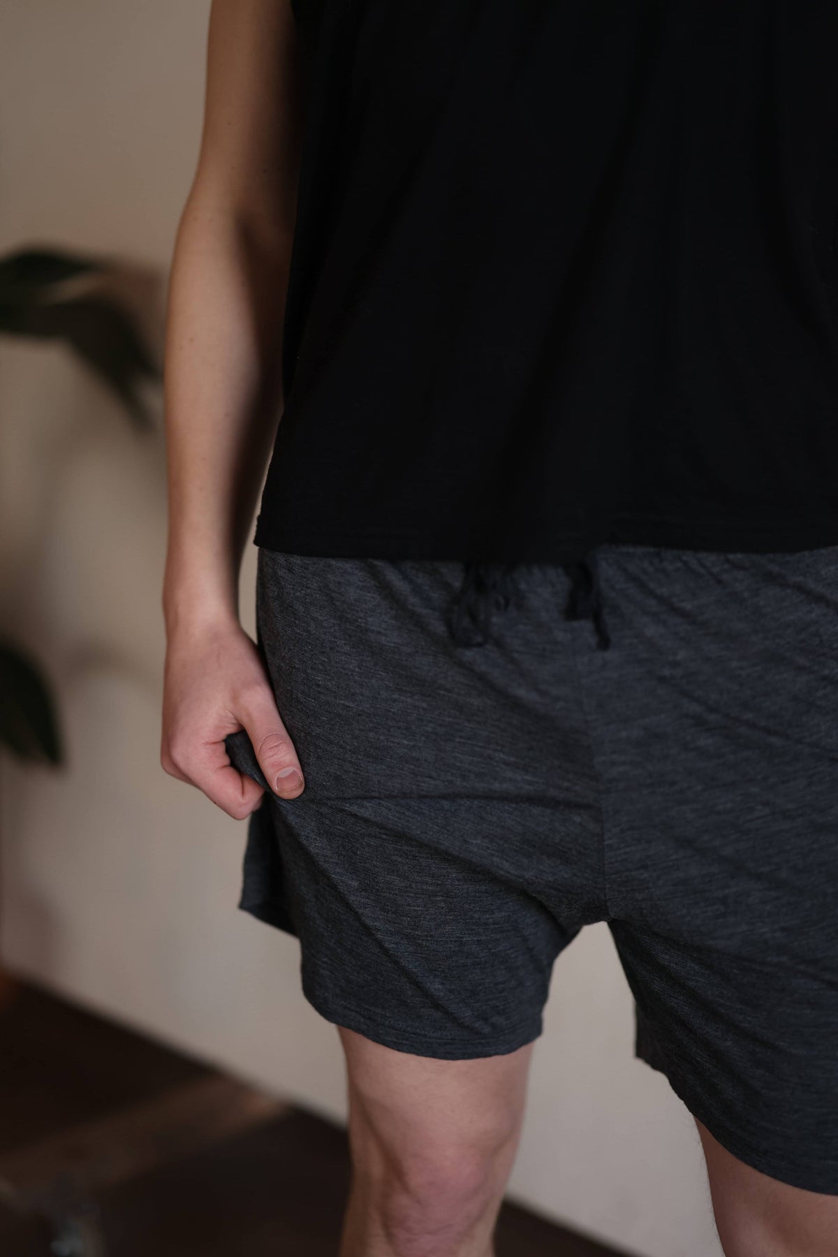 Close-up of men's charcoal merino wool sauna shorts highlighting soft texture, breathable fabric, and comfortable fit.